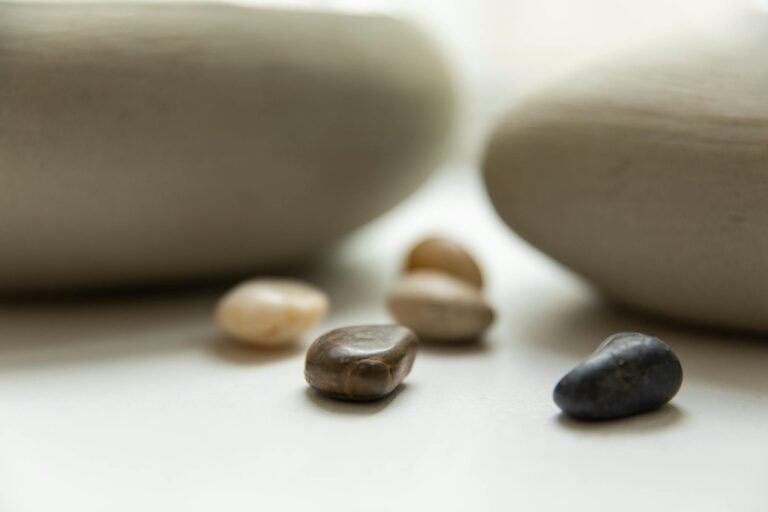 Soft focus image of smooth stones, creating calmness and balance in serene setting.